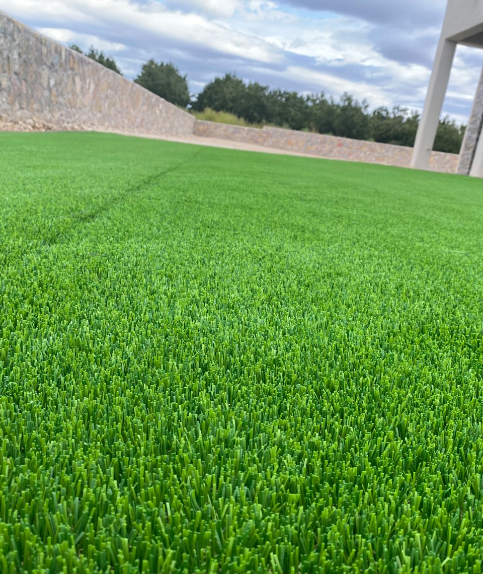 Pet-safe artificial turf backyard installation by Brainard's Greenscapes in Las Cruces
