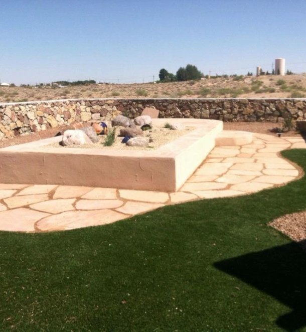 Backyard patio hardscape with seating area