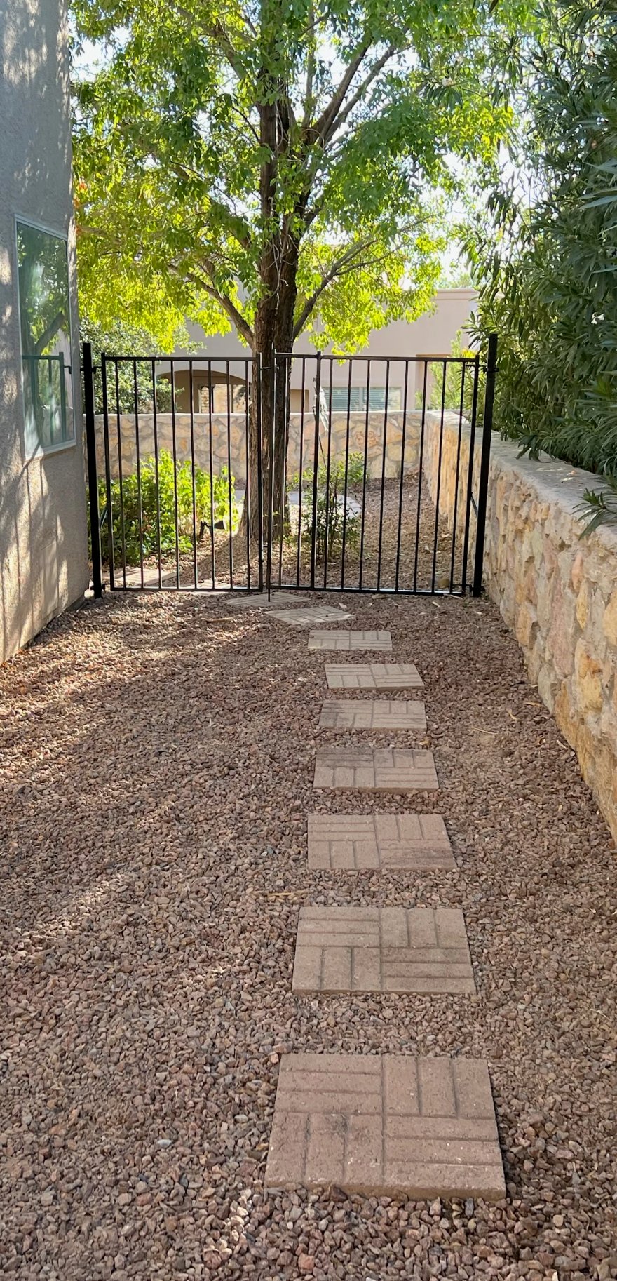 Paver materials installation showing concrete pavers, travertine, and brick by Brainard's Greenscapes in Las Cruces, NM