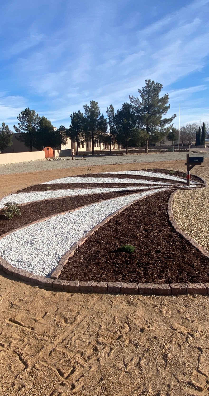Desert garden bed with pressure-compensating drip irrigation installed by Brainard's Greenscapes in Las Cruces, NM